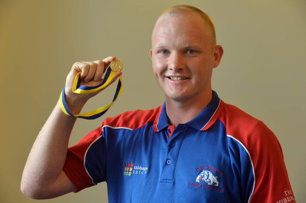 NUMBER ONE: North Bendigo's Tyson Findlay holds the Sam Cheatley Medal. The Bulldogs' onballer is now chasing a premiership victory. Picture: BRENDAN McCARTHY