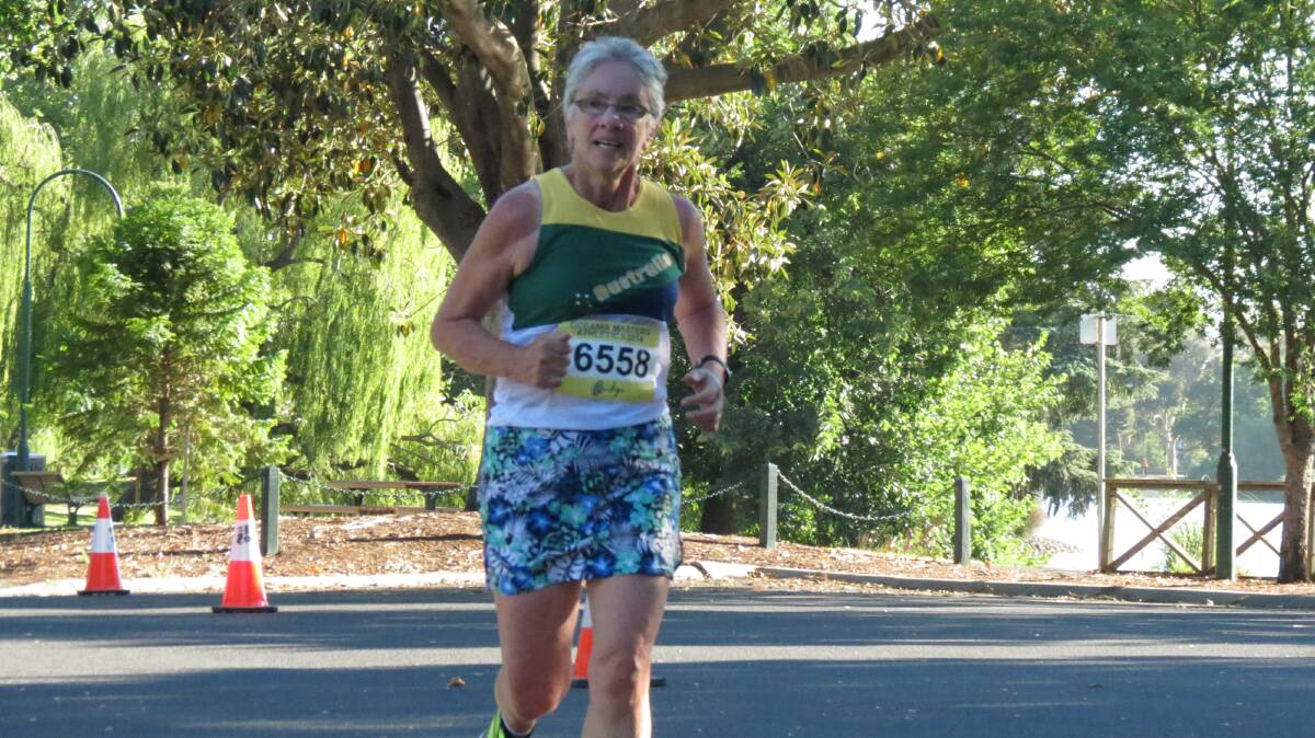 Ros Lowe races around Lake Weeroona in the half-marathon at the Oceania Masters athletics titles in Bendigo. Picture: HUNTER GILL 