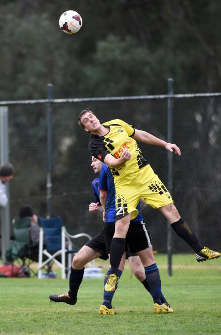 DEFENCE: Colts United's Gerard O'Shea heads the ball against Eaglehawk. Picture: JODIE DONNELLAN
