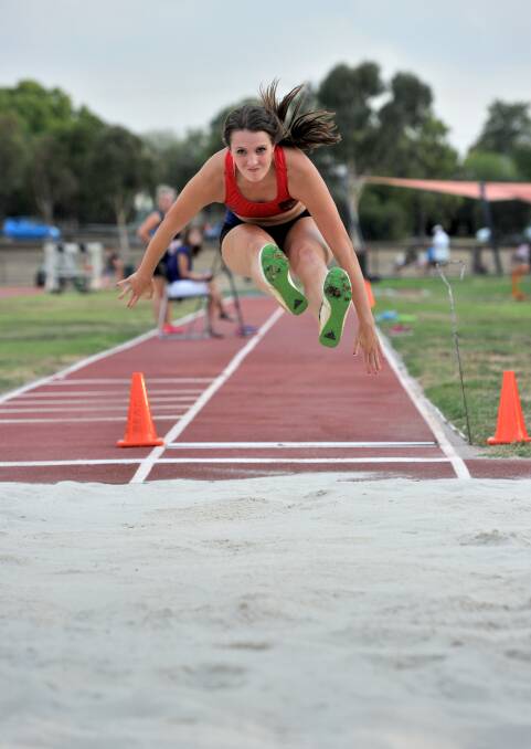 LEAP: Athletics Essendon's Michaela Duncan reached a mark of 4.50m to win the long jump at Athletics Bendigo's meet on Friday night. Picture: JODIE DONNELLAN 