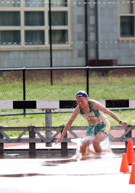 COOL RUNNING: Lisa Davis contests the steeplechase. 