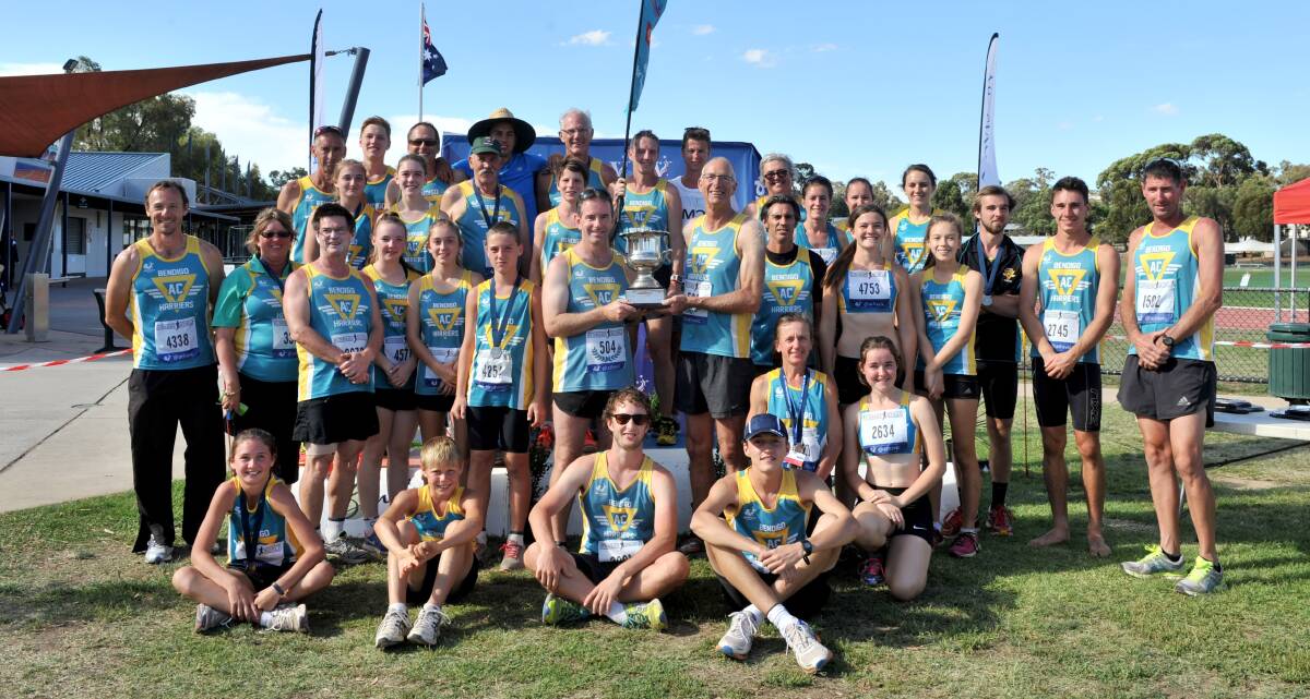 NUMBER ONE: Bendigo Harriers celebrate winning the overall and men's teams awards at the Flack Advisory-backed Victoria Country athletics championships in Bendigo. Picture: JODIE DONNELLAN
