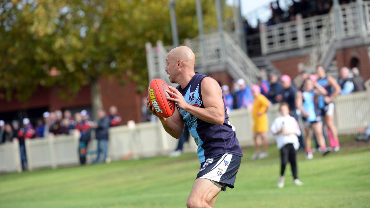 Eaglehawk's Damien Lock looks to set up another attack for the Two Blues. Picture: LIZ FLEMING