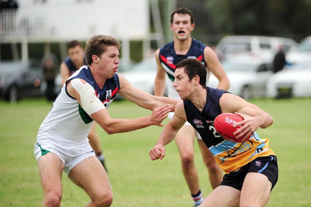 HOT FORM: Josh Ryan tries to evade NSW-ACT’s Zach Johns in the Bendigo Pioneers win in Mildura. Picture: David Sickerdick, Sunraysia Daily 