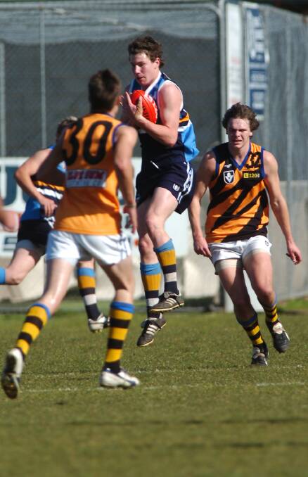 Grant Weeks marks against Dandenong in the 2005 TAC Cup season. 