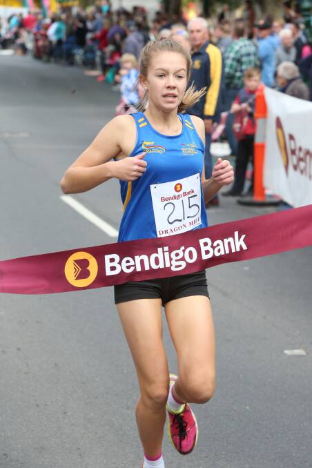 Kate Salvador from Bendigo South East Secondary College wins the years 9-10 girls race in the Bendigo Bank Dragon Mile. 