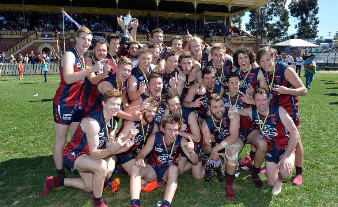 VICTORIOUS: Sandhurst celebrates after a 10-goal victory in the reserves grand final. Picture: JIM ALDERSEY