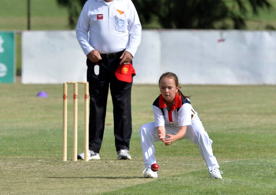 NO RUN: Laura Niejalke fields off her own bowling in South Australia's match against Victoria on North Bendigo's turf. 