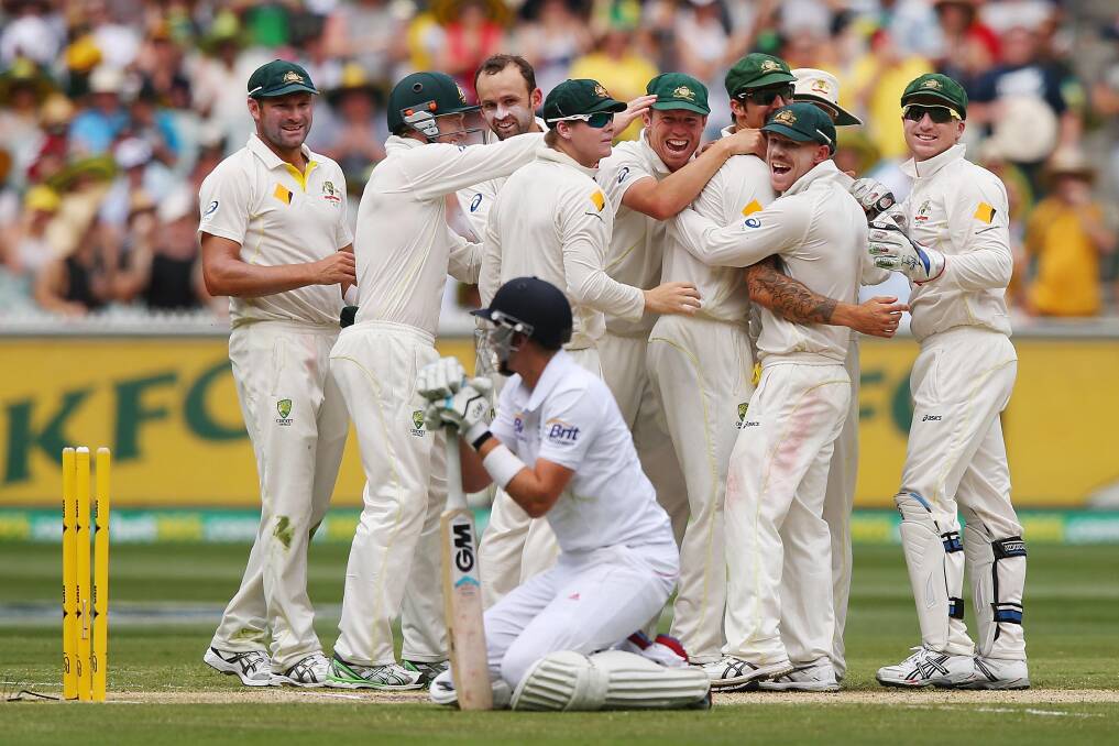 HOWZAT: Australia's players celebrate the run out of England's Joe Root during the Boxing Day Test in Melbourne. Picture: GETTY 