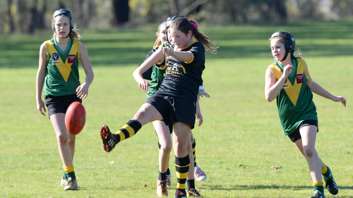 SKILLS: Big Hill attacks against St Kilian's at the footy carnival. Pictures: JIM ALDERSEY