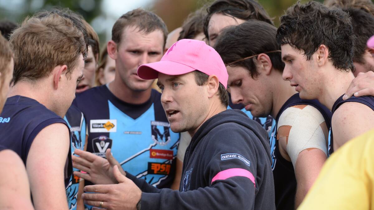 Eaglehawk coach Luke Monaghan gives instructions at quarter-time. Picture: LIZ FLEMING