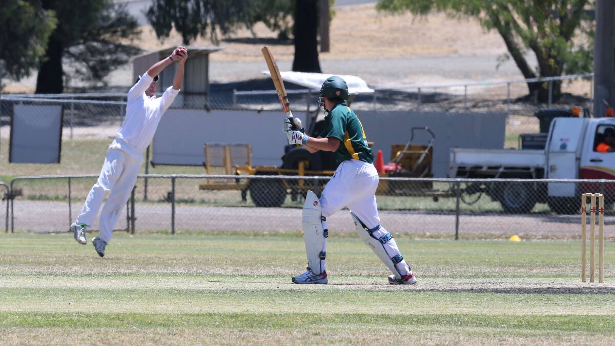 WHAT A CATCH: Benalla's Travis King leaps high to dismiss Jack Leith. Pictures: PETER WEAVING