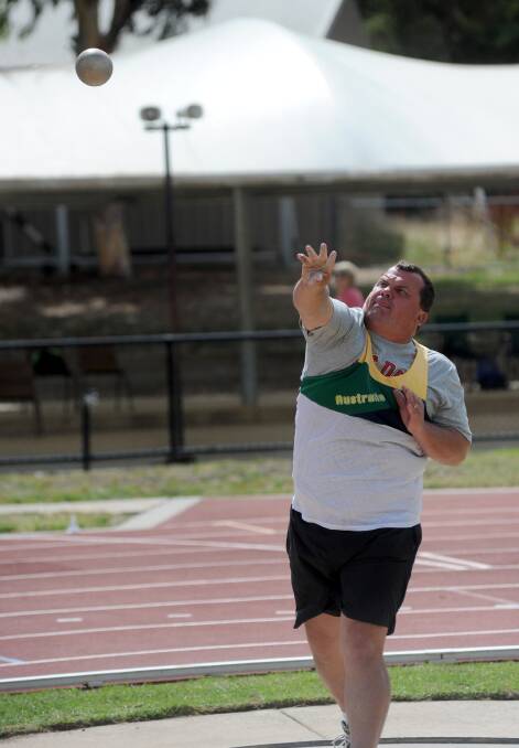 FOCUSED: Rodney Watson competes in the shot put. 