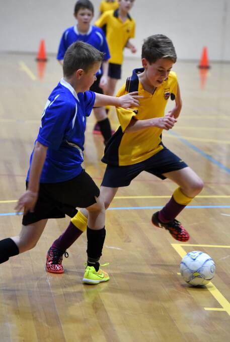SKILFUL: Girton takes on Strathfieldsaye in the 12-boys competition at Bendigo Stadium. 