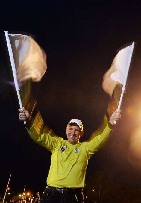 GOAL: Footy umpire Ross Court waves the flags. Picture: BRENDAN McCARTHY