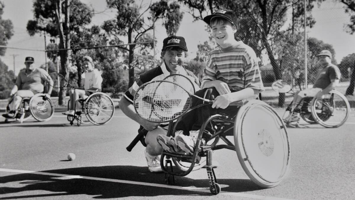Long-time tennis coach Steve Storer and Jye Yates at a promotion for wheelchair tennis in 1994. 