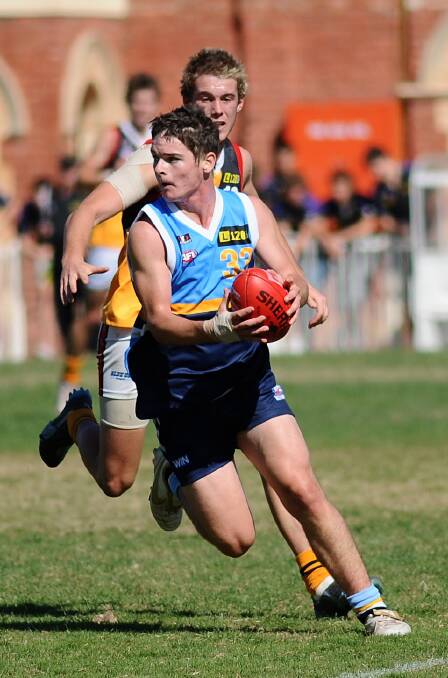 Jye Sandiford looks to set up an attack at the QEO in 2009. 
