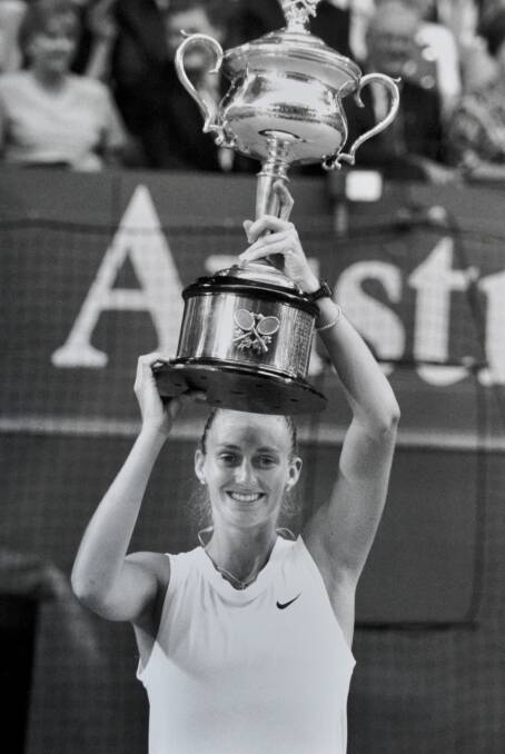 Mary Pierce hoists the trophy after winning the Australian Open women's singles final in 1995. 