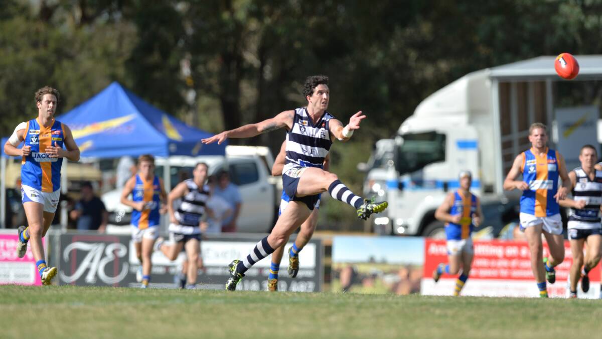 Strathfieldsaye's Jake Hall kicks for goal in the round one clash with Golden Square. 