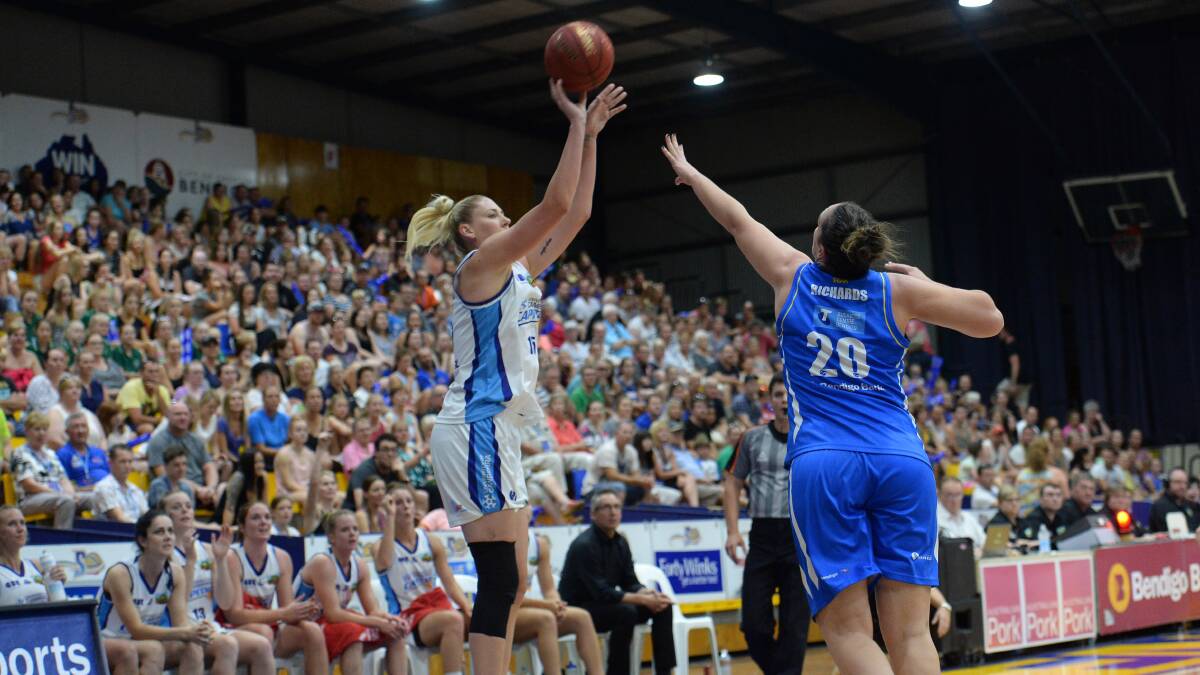 LEGEND: Canberra's Lauren Jackson aims for the basket as Gabe Richards defends. Picture: JIM ALDERSEY