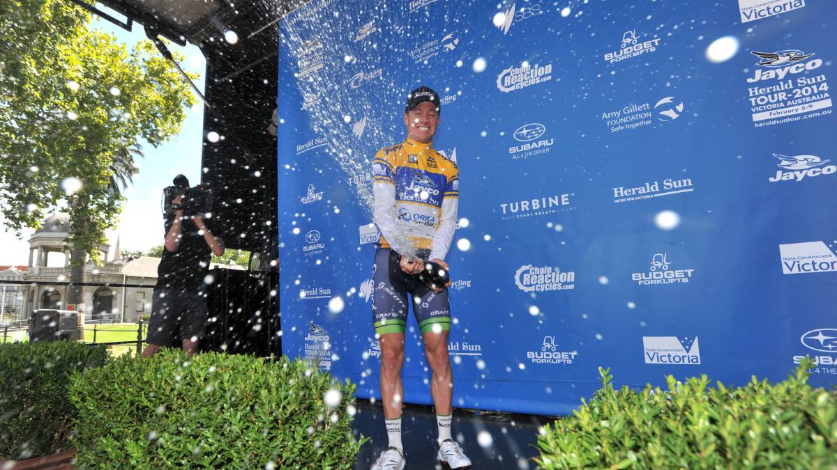 CHAMPAGNE FLOWS: Simon Clarke celebrates after winning the stage to Bendigo and grabbing the tour lead. Picture: JIM ALDERSEY