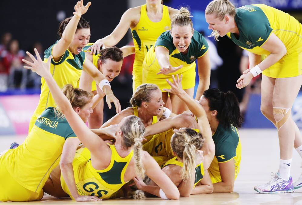 Australian netballers including Bendigo's Caitlin Thwaites, right, celebrate their Commonwealth Games gold medal win. Picture: FAIRFAX
