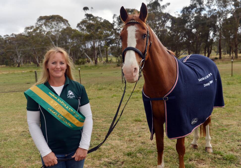 Sharon received a sash and prize rug for Ricky in recognition of her Top Ten dressage win. Picture: BRENDAN McCARTHY