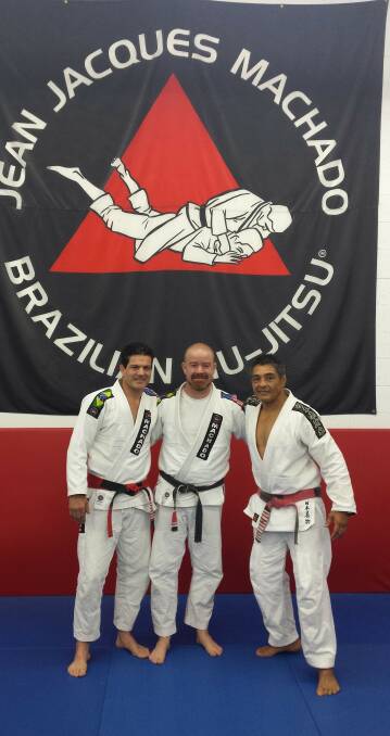 LEGENDS: Bendigo Brazilian Jiu Jitsu instructor Stewart Moulden, centre, with international masters Jean Jacque Machado and Rickson Gracie. Picture: SUPPLIED 