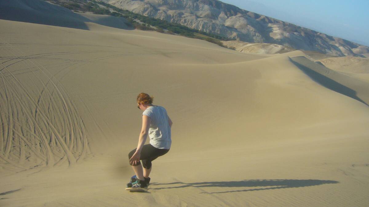 Riding the dunes in Peru on a sandboard. Picture: SUPPLIED