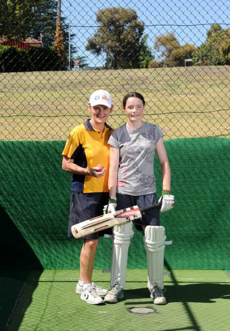 TOP TIPS: Former Australian cricketer Annette Holmes gives Victorian representative Kate Douglass some batting advice ahead of the national championships. Picture: JODIE DONNELLAN 