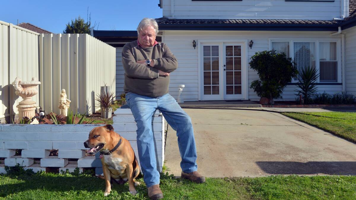 A Gentleman's Dog:  Knuckles, and his dad Rod, taking some time out together.
Picture: BRENDAN McCARTHY