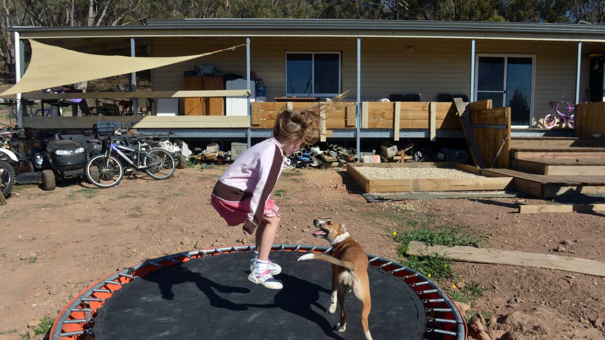 A Family's Dog #1:  Elliotte and April playing on the backyard trampoline.
Picture: BRENDAN McCARTHY