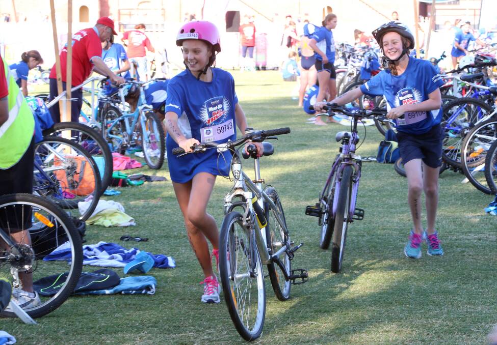 Weet-Bix Kids TRYathlon at Queen Elizabeth Oval, Bendigo.
11-15 year olds at transition.
Pip Robertson heads off to ride.
Picture: PETER WEAVING