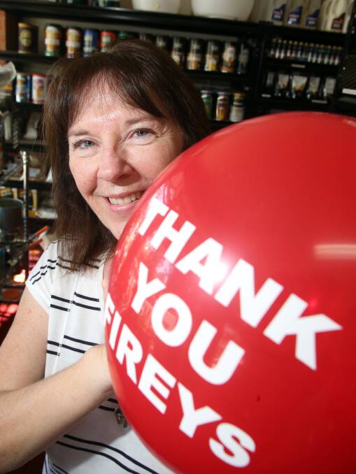 RECOGNITION: Sandhurst Butchers Supplied and Home Brew owner Joanne Stratford with a red balloon. 