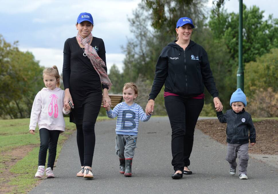 POUNDING THE PAVEMENT: Kassidy, Ange and Axel Cail with Sharyn and Isaac Baré. Picture: JIM ALDERSEY