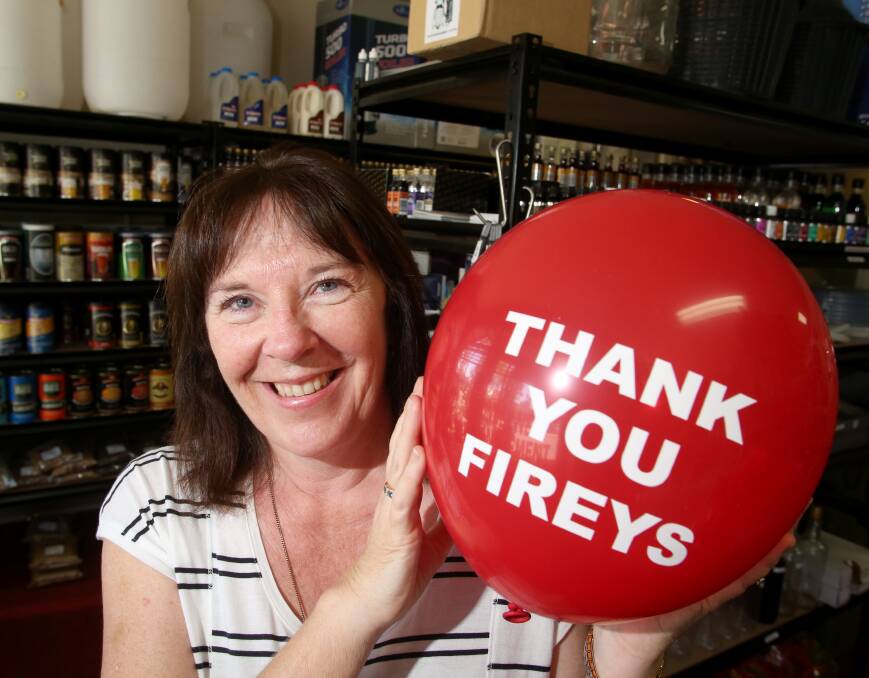 RECOGNITION: Sandhurst Butchers Supplied and Home Brew owner Joanne Stratford with a red balloon. 
