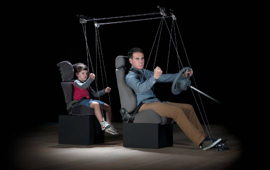 COPY CAT: An image taken from the advertising campaign shows a child mimicking the behaviour of his father. 