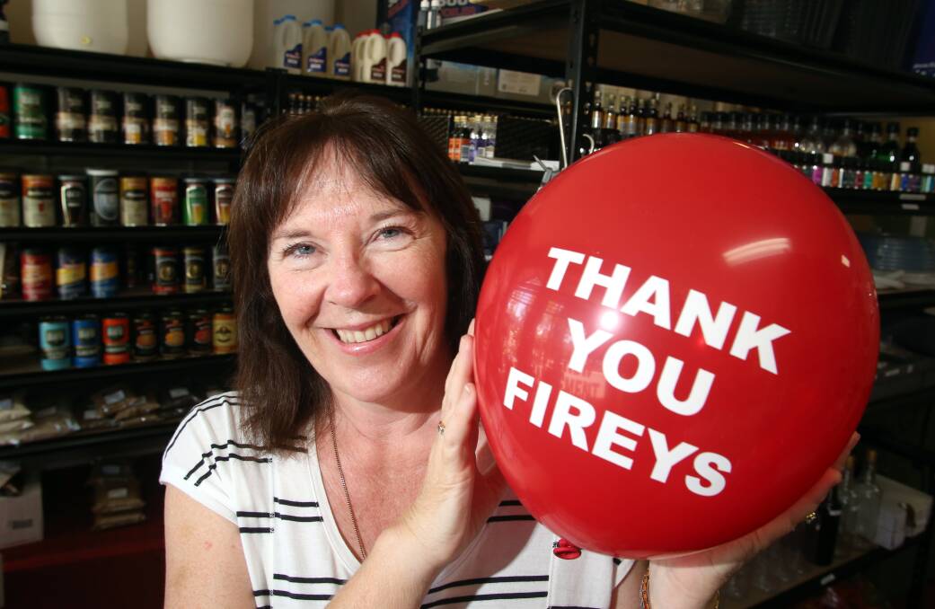 RECOGNITION: Sandhurst Butchers Supplied and Home Brew owner Joanne Stratford with a red balloon. Picture: GLENN DANIELS
