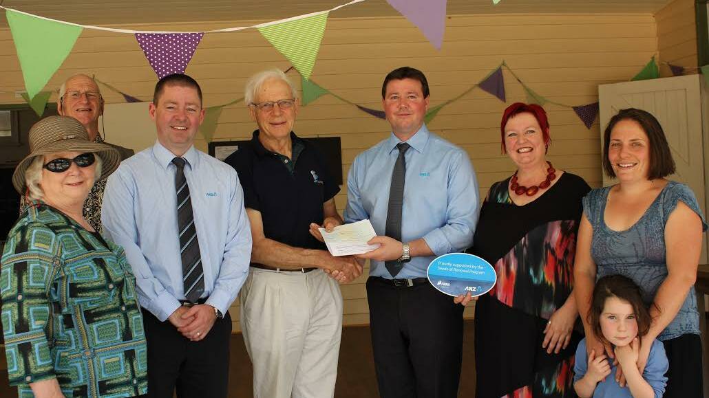 FUNDING: ANZ's Nathan Carkeek presents a cheque for the school. 