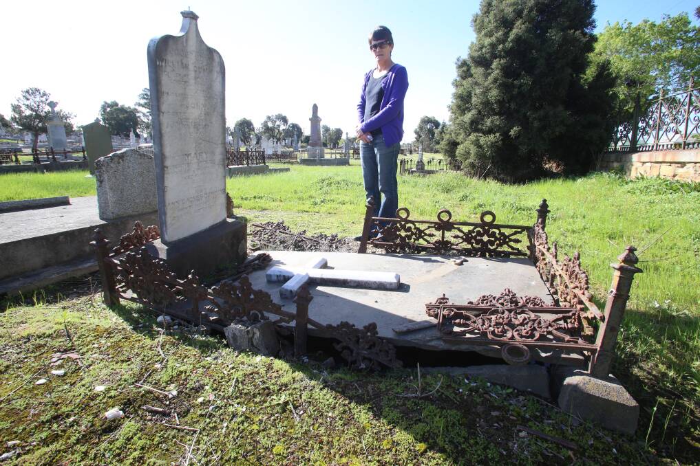 Debbie Ross at Bendigo cemetery last year in front of a derelict grave.
Picture: PETER WEAVING