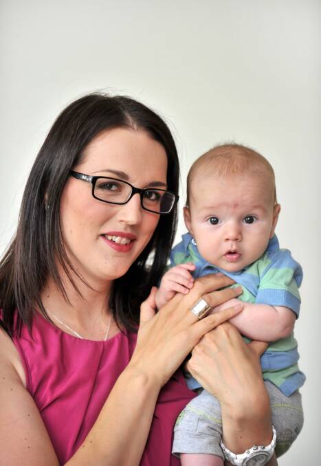 ON MOVE: Kassie Nikitenko with son Oliver. Picture:JODIE DONNELLAN