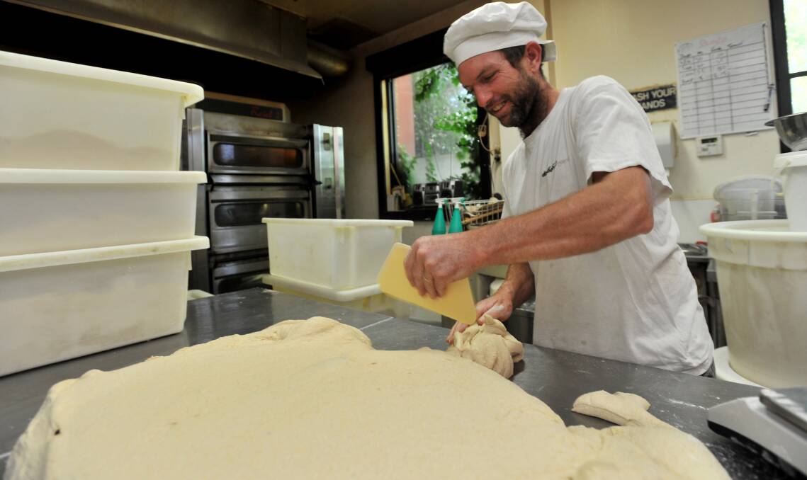 HANDY: Ken Hercott makes bread at Sprout bakery. Picture: JODIE DONNELLAN