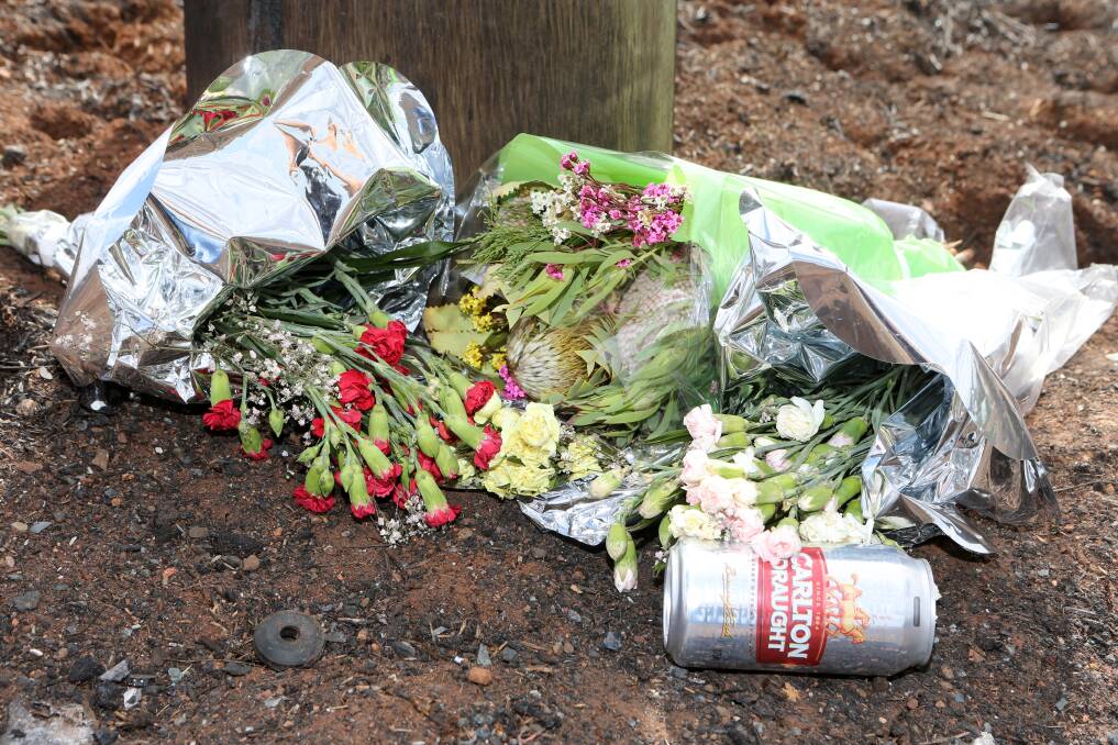 A floral tribute was left at the scene of a crash which claimed four lives. Picture: GLENN DANIELS