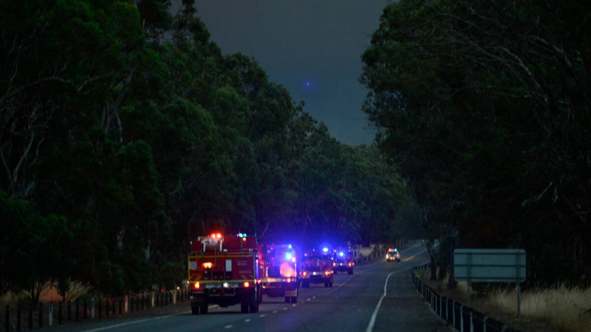 HELP: A CFA strike team heads north along the Western Highway. Picture: THE AGE