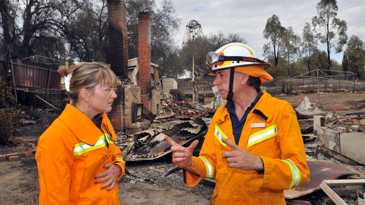 FEBRUARY 8, 2009: MP Jacinta Allan talks with Jim Hickson from the CFA at one of the houses lost in Happy Valley Road. Picture: Peter Hyett