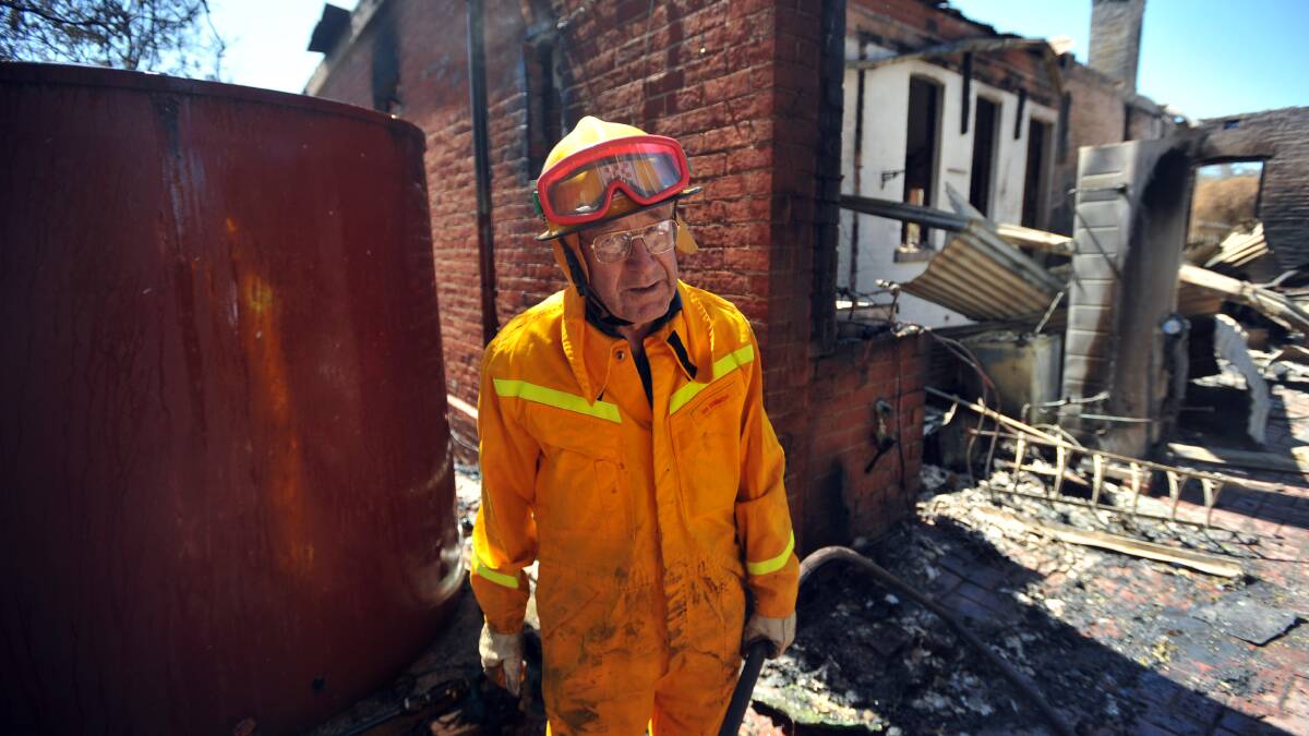 FEBRUARY 9, 2009: Ian Semmens seen here assisting in firefighting duties at Eaglehawk has been a CFA member for over 60 years. Picture: Nick McGrath