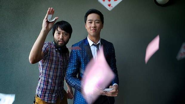 Lawrence Leung (left) tries his hand out for John Luc. Photo: Simon Schluter, SMH