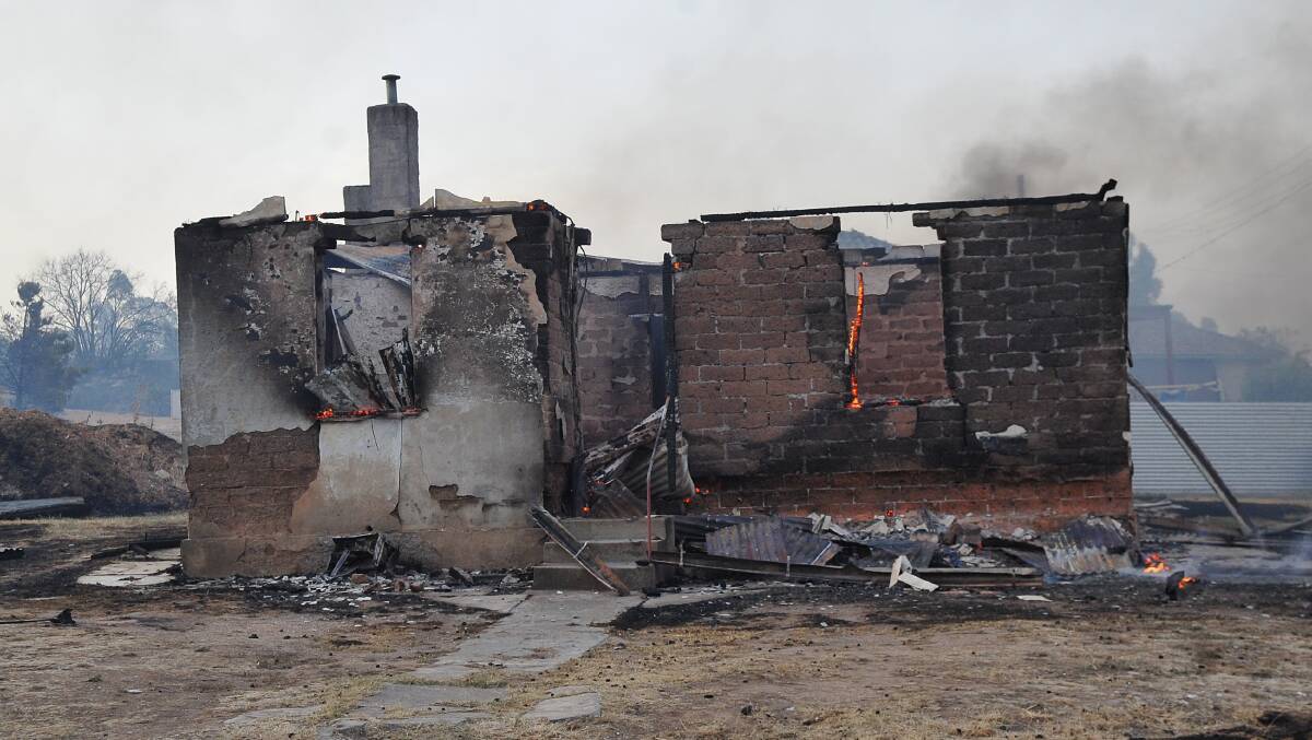 FEBRUARY 7, 2009: The aftermath of a fire-engulfed property in Sparrowhawk Road. Picture: Julie Hough