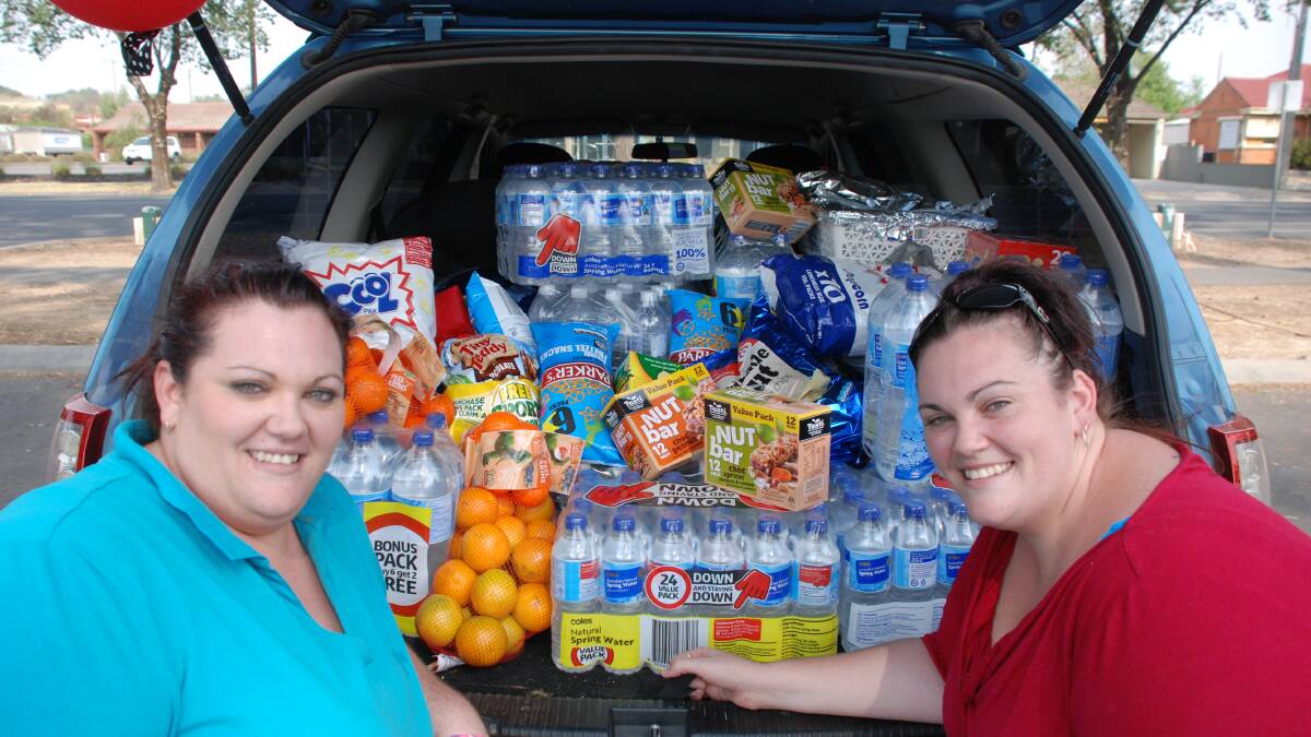 ON WAY: Tina and Emily Batterham with the goods to be delivered to Donnybrook. Picture: EMMA-JAYNE SCHENK 