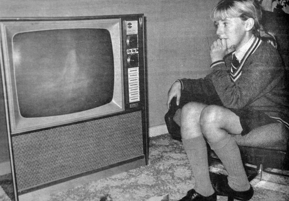 Karyn Armstrong sits glued to the television as the US astronauts touch down on the moon.